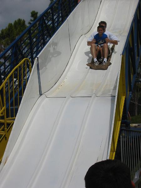 111-1193_IMG.JPG - School carnival. That's Trevor & Daddy going down the slide.