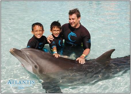 allwithdolphins.bmp - The guys got to pet the dolphins.